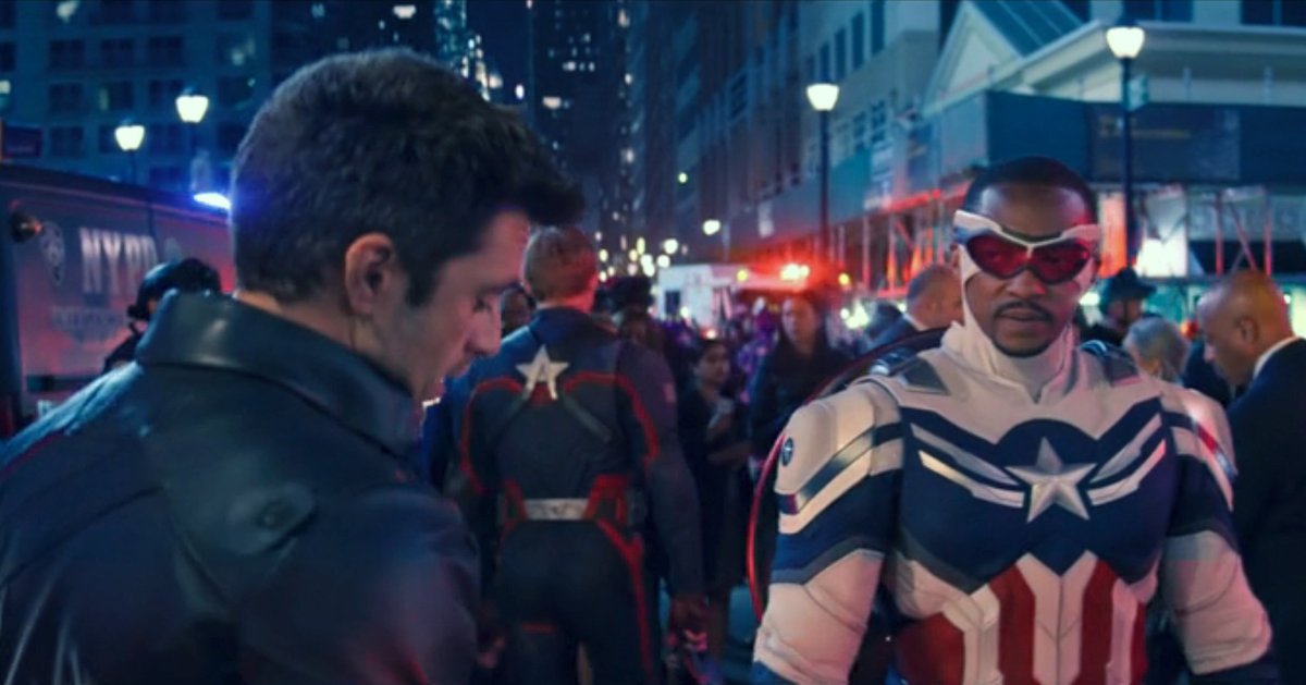 Bucky (Sebastian Stan) and Captain America/Falcon (Anthony Mackie) speak in a crowded NYC city street in a shot from The Falcon and The Winter Soldier